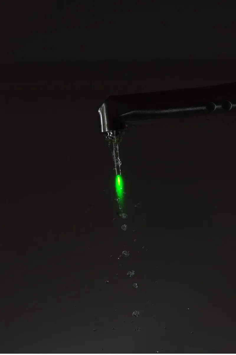 A dental laser handpiece with its guide light switched on