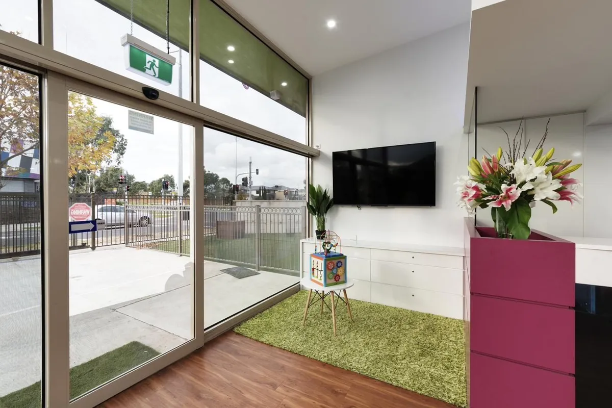 A bright children's area at a Magical Smiles clinic, with toys and natural light.
