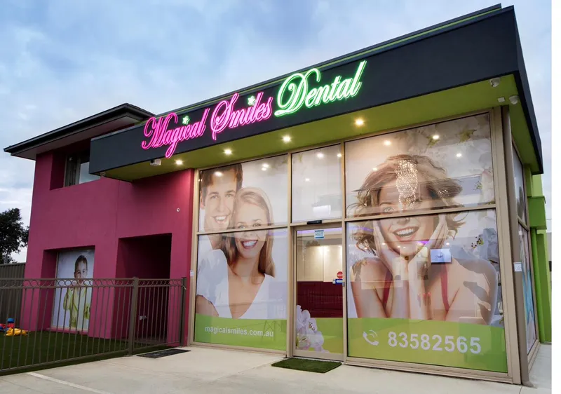 Magical Smiles neon sign above the clinic entrance