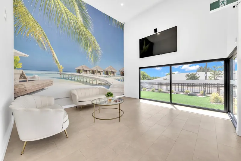 Waiting area with a palm tree feature wall