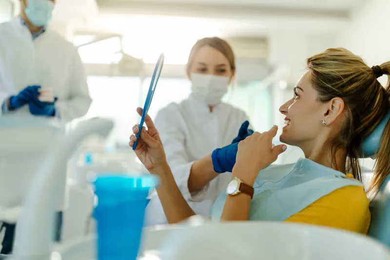 Dentist and patient seated together, talking through cosmetic options