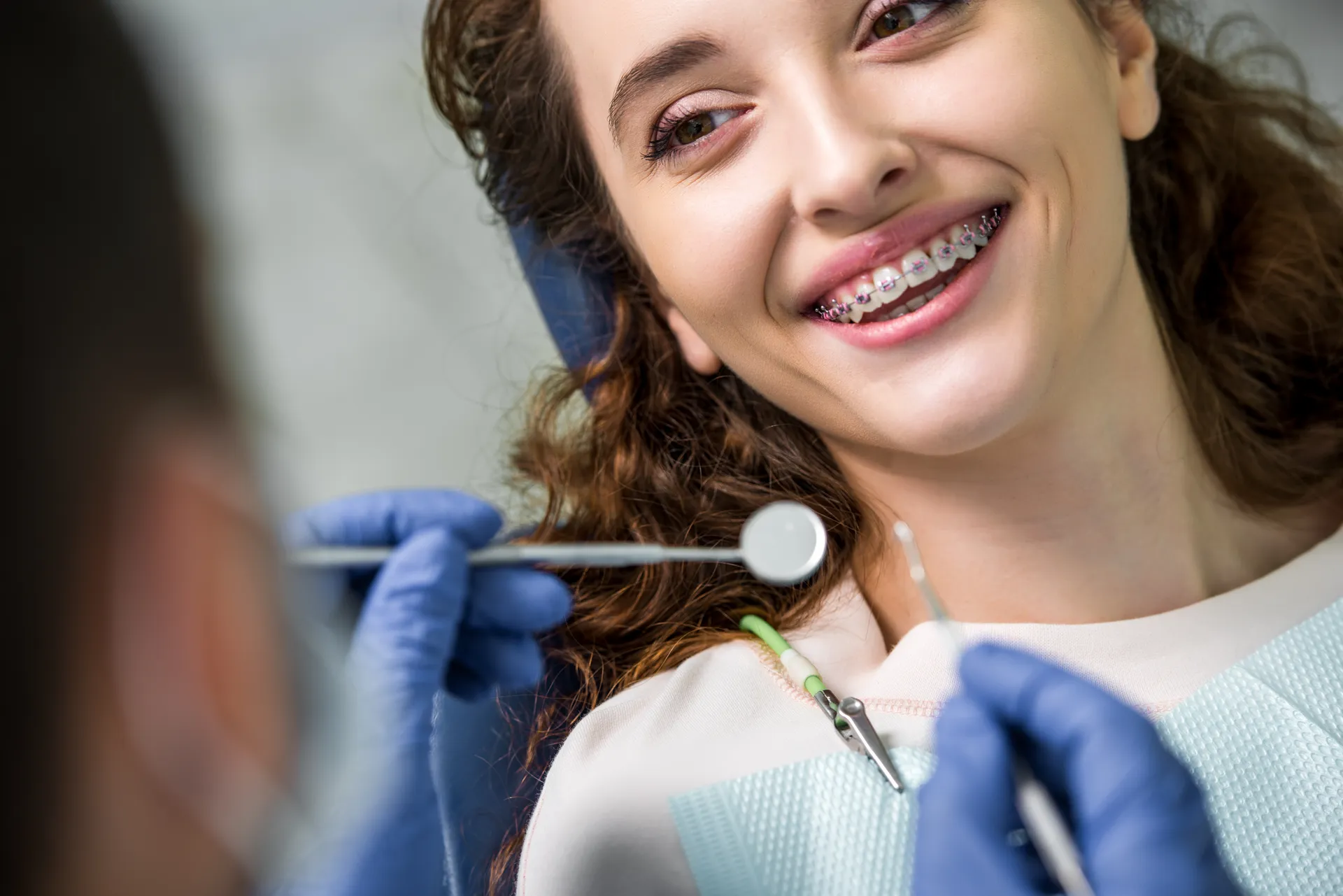 Smiling woman with braces during a dental check-up